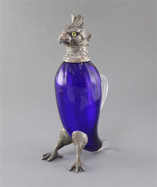 A late Victorian silver plate mounted blue glass novelty claret jug, modelled as a parrot, 29.5cm.